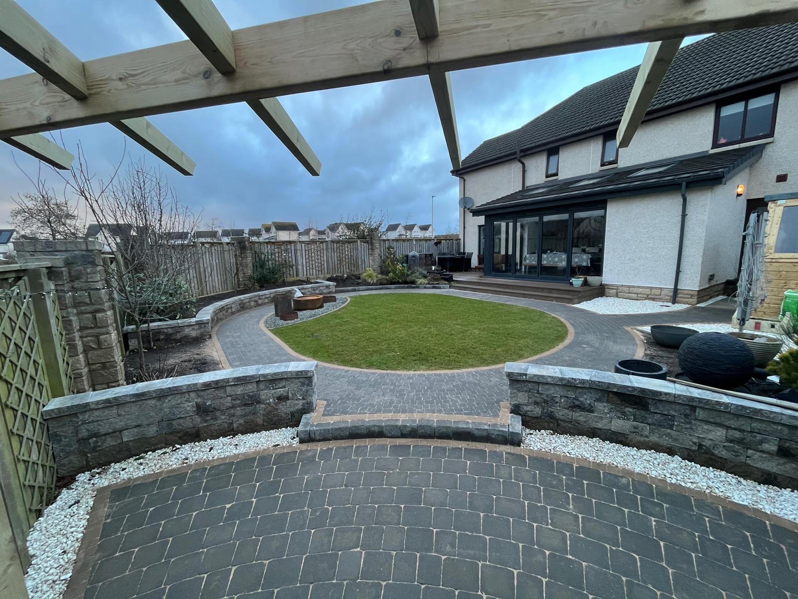 Timber pergola with curved paving and raised walling Kirkliston Edinburgh