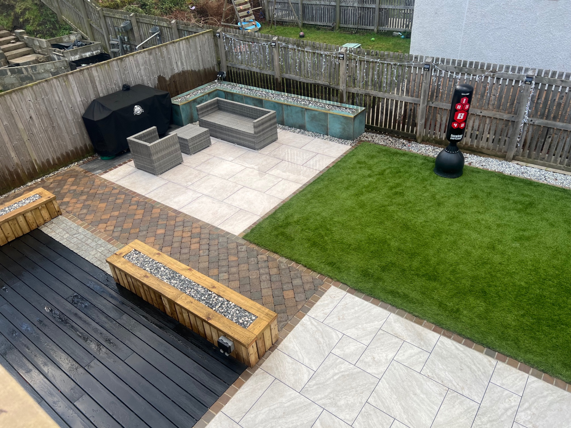 Multi-level garden transformation with composite decking and raised planters