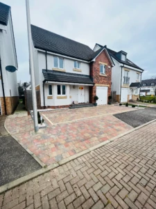 "Transforming the entrance with style and sophistication! Our recent project in Kirkliston, Edinburgh showcases a stunning Tobermore Shannon Heather driveway, complemented by beautifully placed driveway lighting. The addition of Topiary Buxus Balls adds a touch of natural elegance, making this garden makeover a true statement of contemporary beauty." clean and maintain driveways